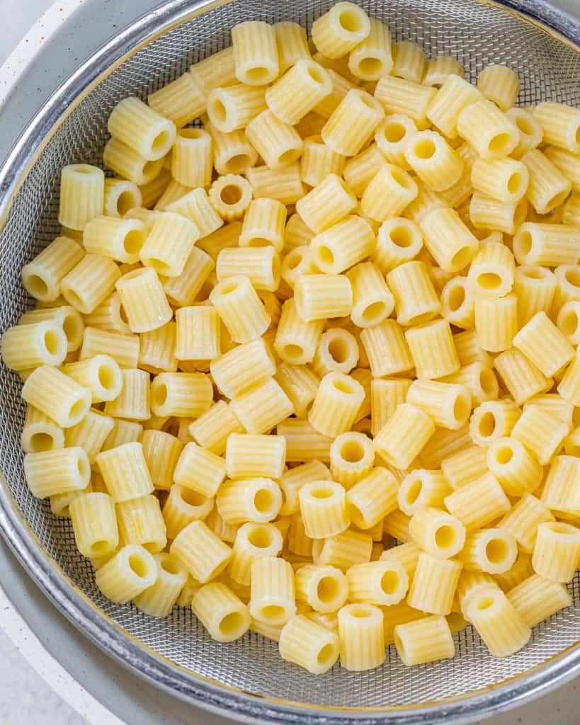 Boiled pasta in a colander. 
