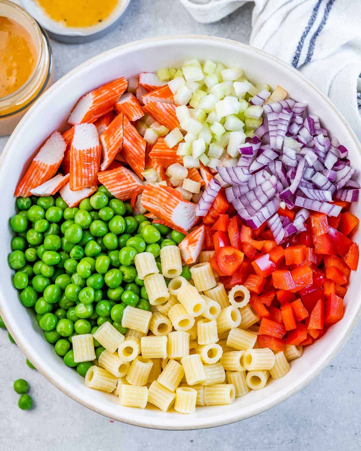 Pasta salad assembled in a white serving bowl.