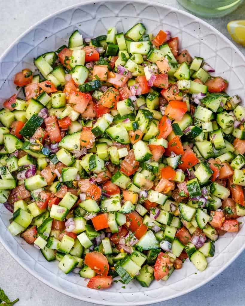 top view shirazi salad in a round plate 