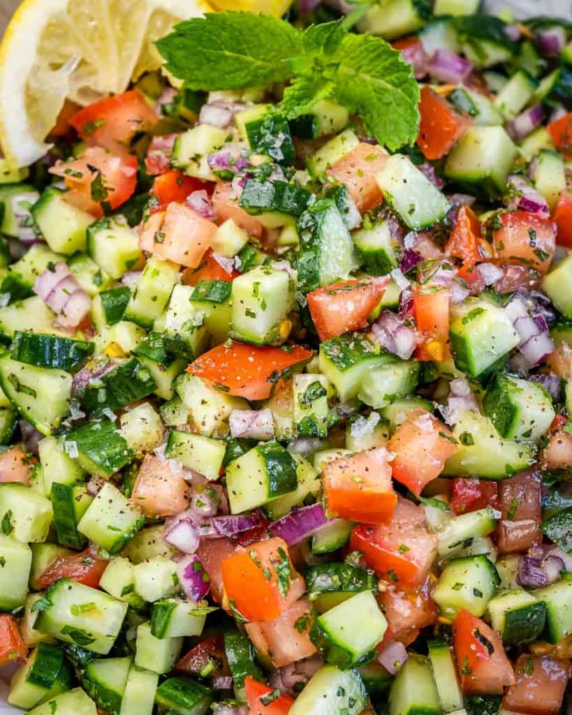 close up view of chopped tomato cucumber and onion salad 