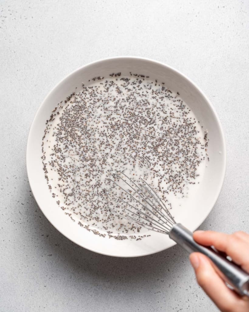 Whisking chia seeds with milk.