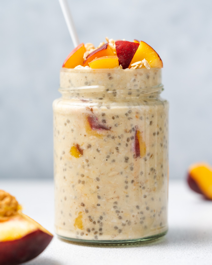 side shot of a jar with overnight oats with peaches