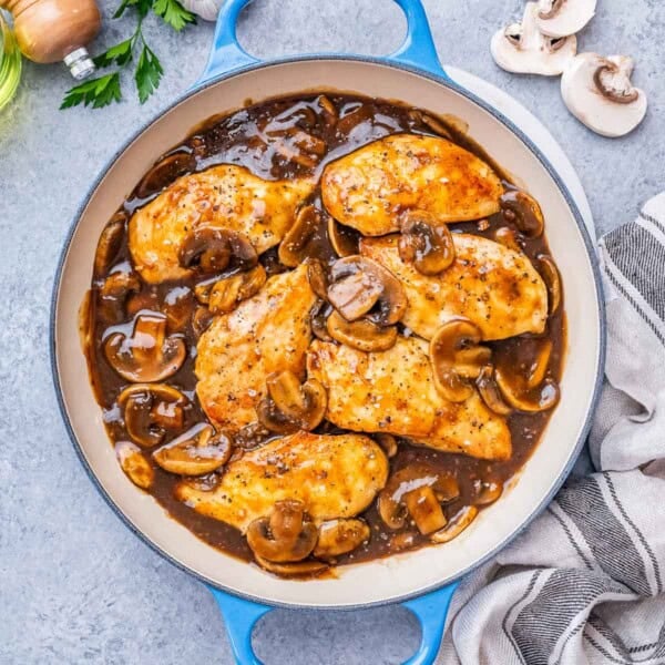 Chicken Marsala in a mushroom sauce in a pan.