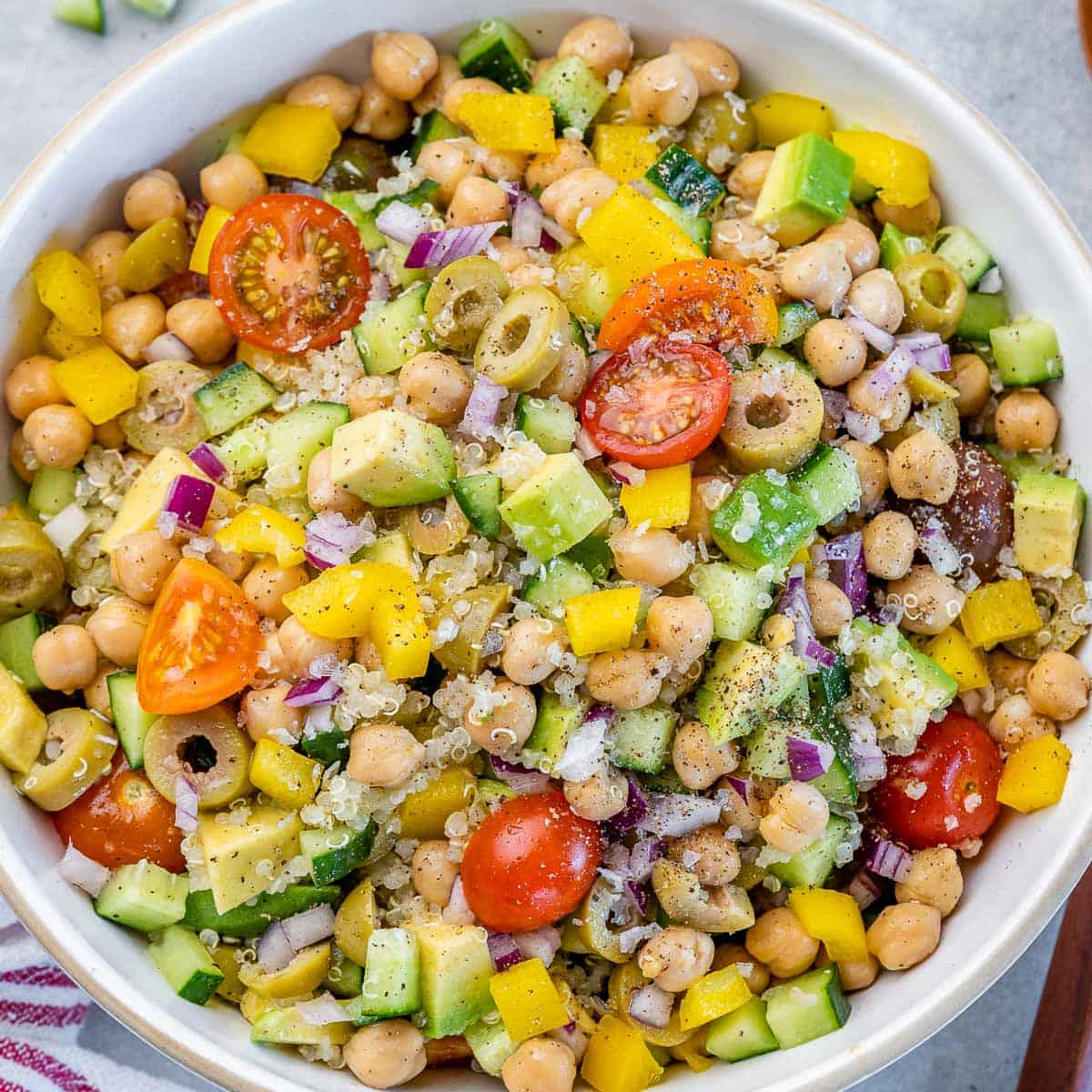 top view quinoa and chickpea salad in a round white bowl