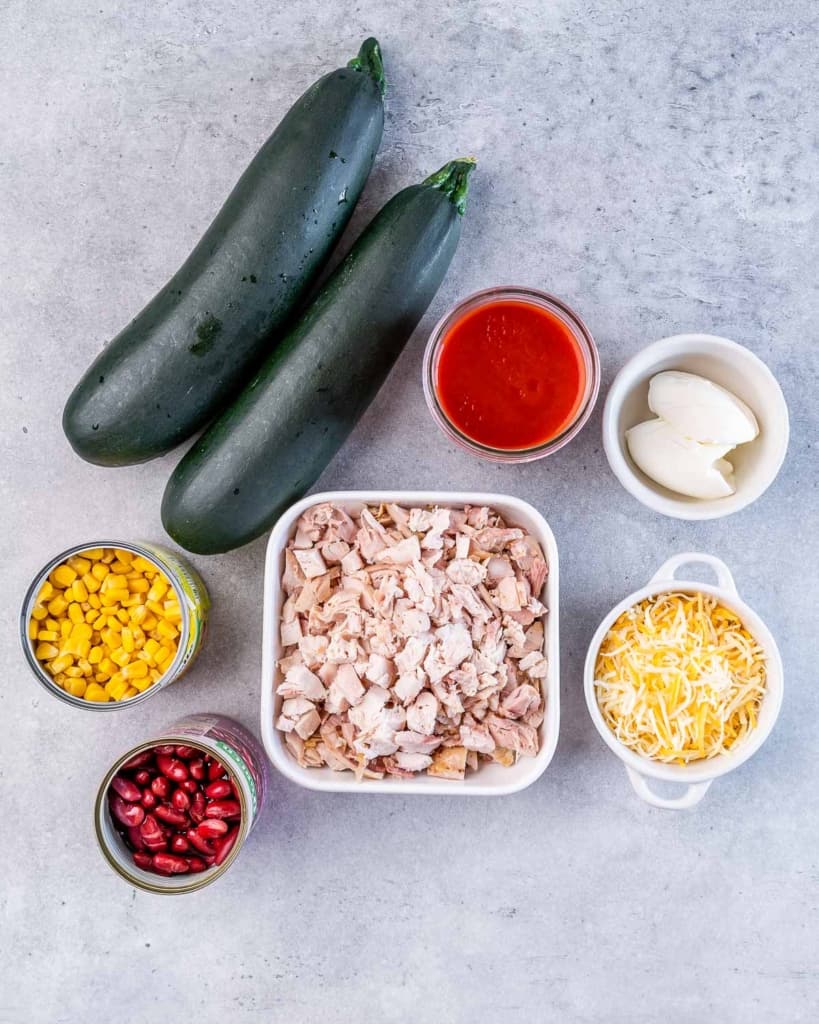 ingredients laid out to make chicken enchilada zucchini roll ups 