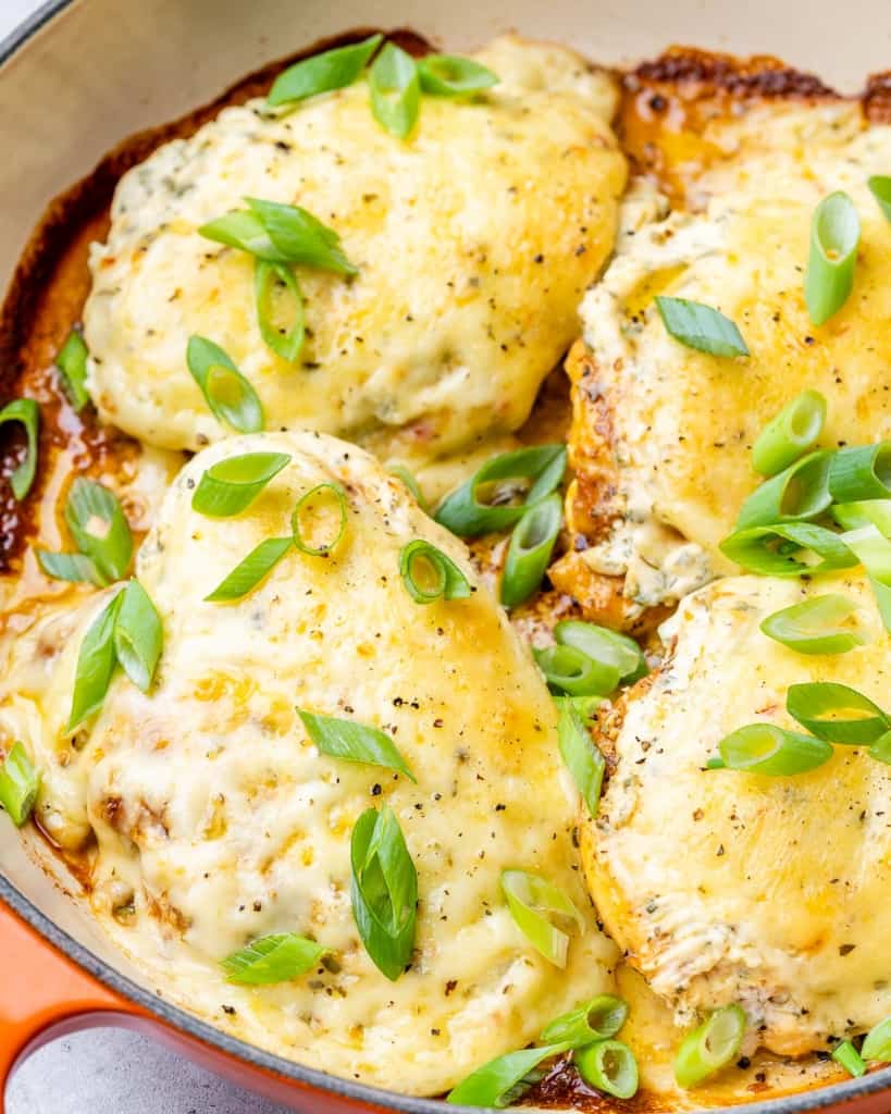 Chicken breast covered in cheese baked in a pan.