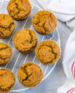 Healthy pumpkin muffins cooling on a wire rack.