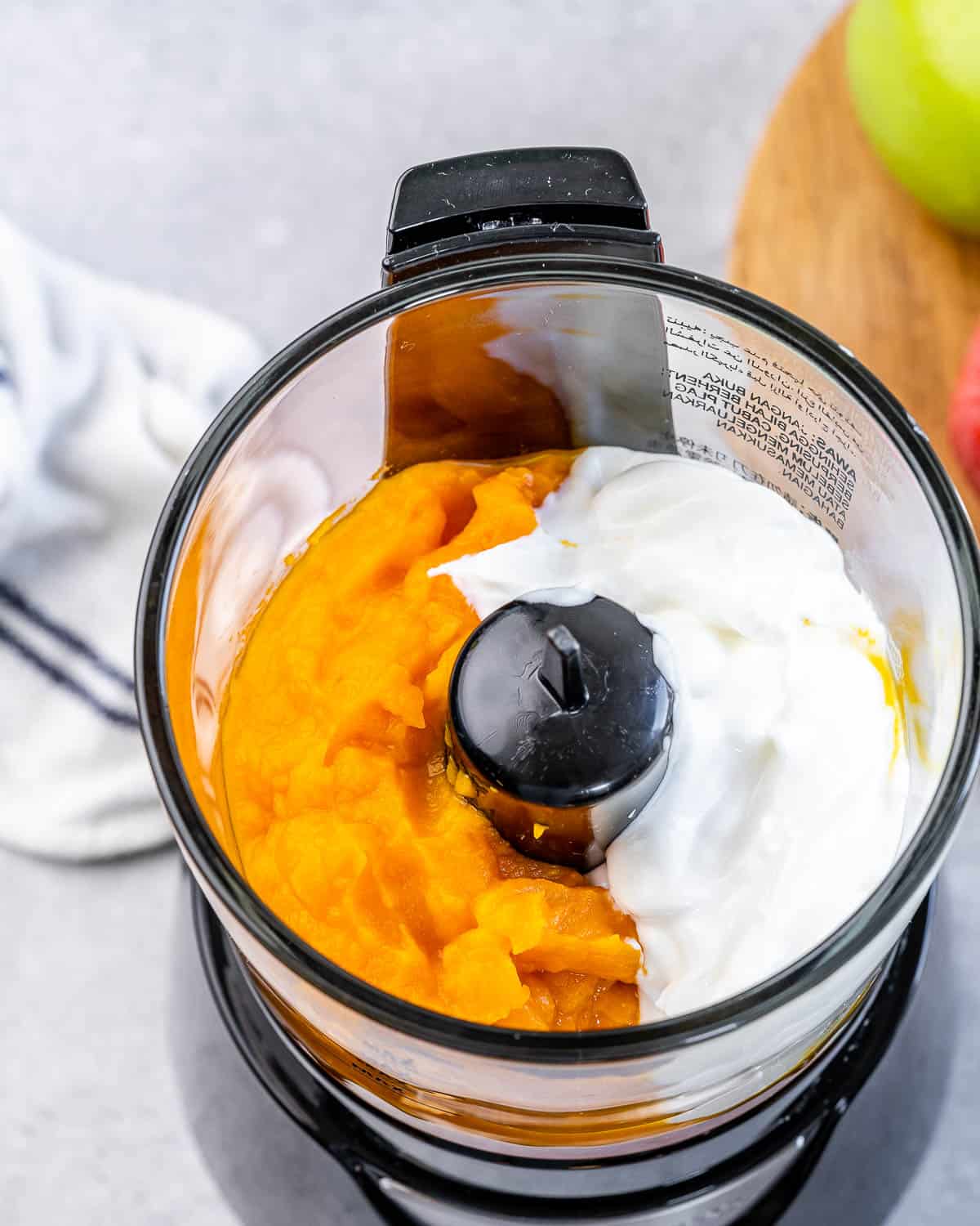 Pumpkin, greek yogurt and vanilla in a food processor.
