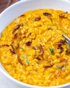 Risotto topped with caramelized onions and fresh thyme.