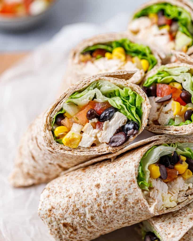 close up shot of chicken wraps on a plate 