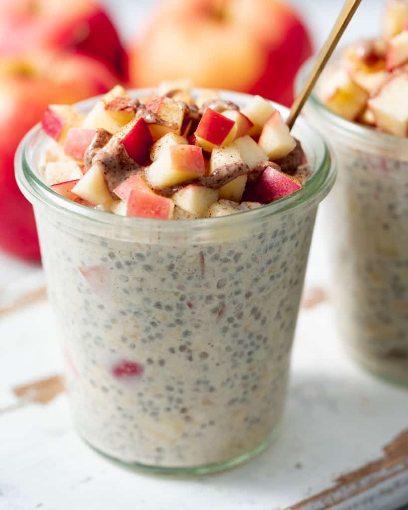 Overnight oats topped with diced apple and a drizzle of almond butter.