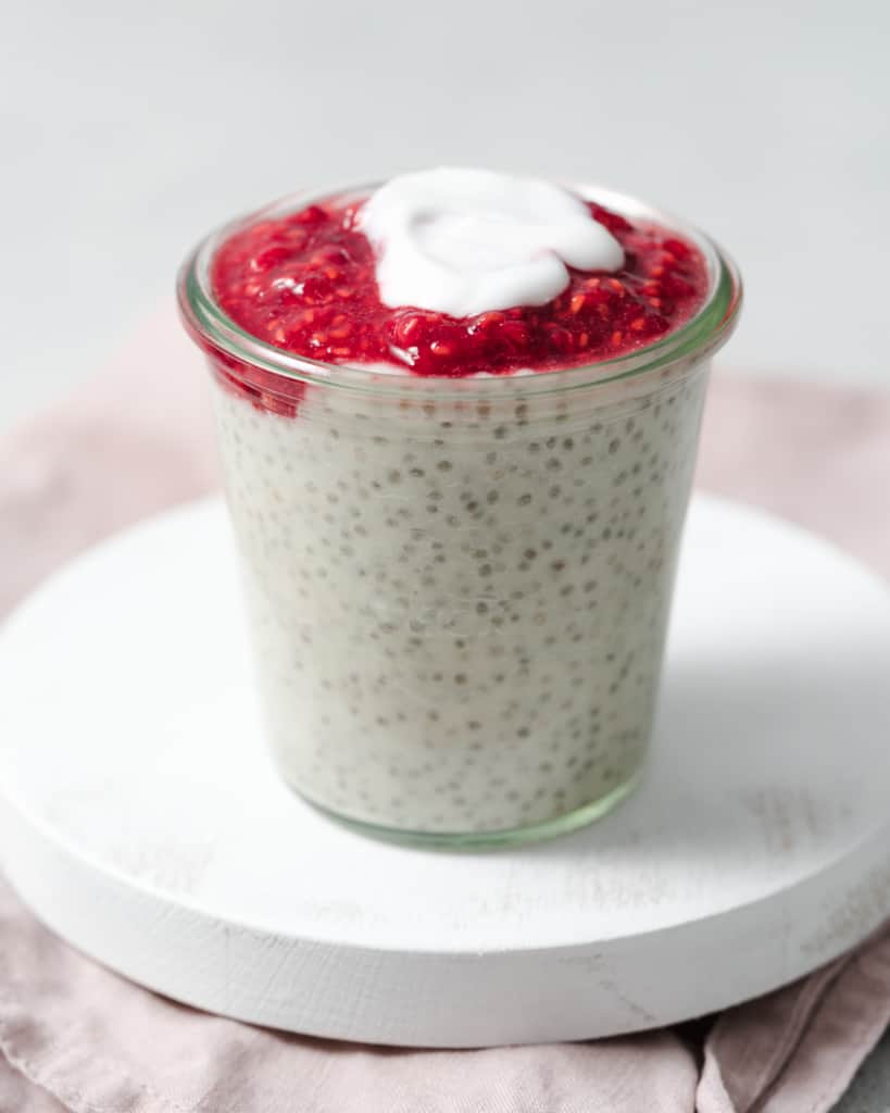 Adding a dollop of yogurt on top of chia pudding.