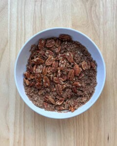 pecans are added over the flour base for the casserole topping.