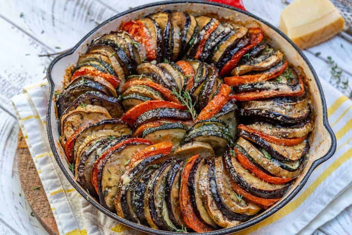 eggplant and zucchini gratin in a skillet.