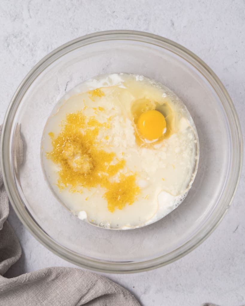 egg, oil, and milk added to a bowl