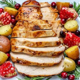 sliced roasted turkey breast over a plate.