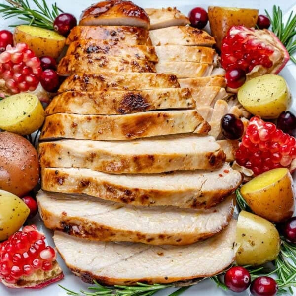 sliced roasted turkey breast over a plate.