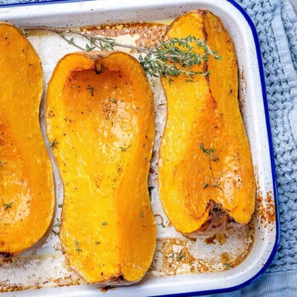 roasted butternut squash wedges on a pan.