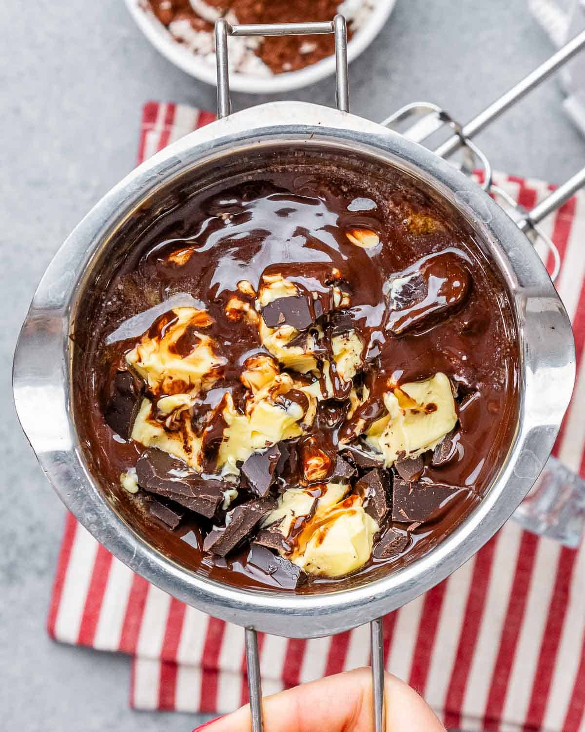 chocolate and butter being melted in a bowl.