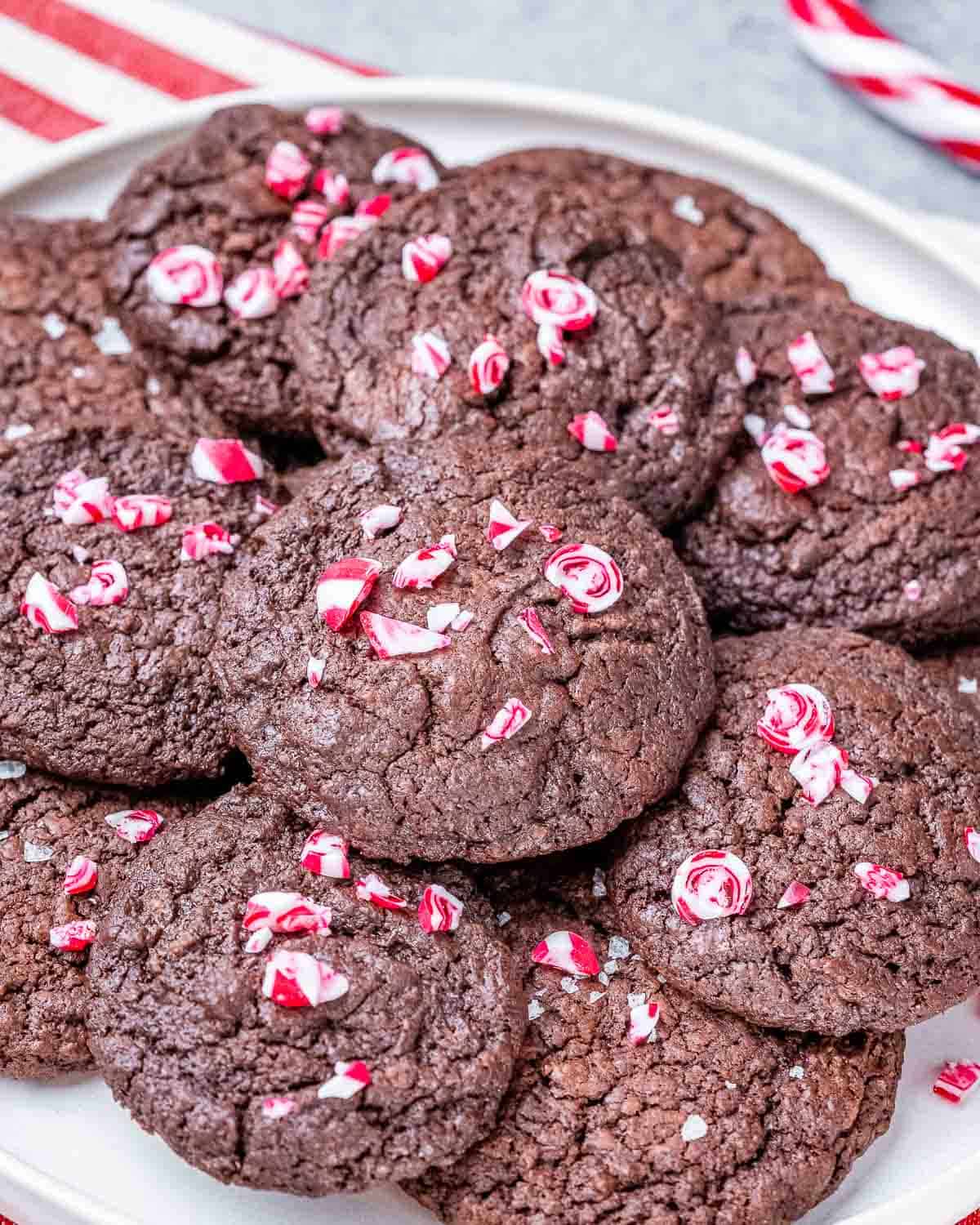 brownie cookies stacked on a plate.