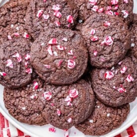 brownie cookies on a plate topped with mint chips.