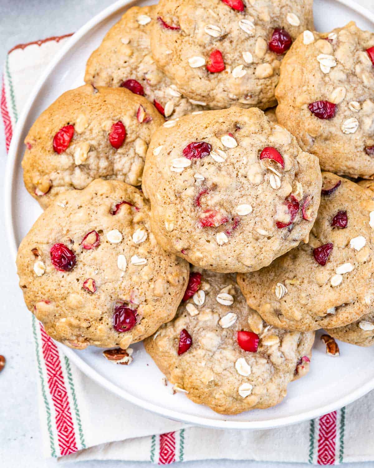 Closeup view of cranberry oatmeal cookies on a plate.