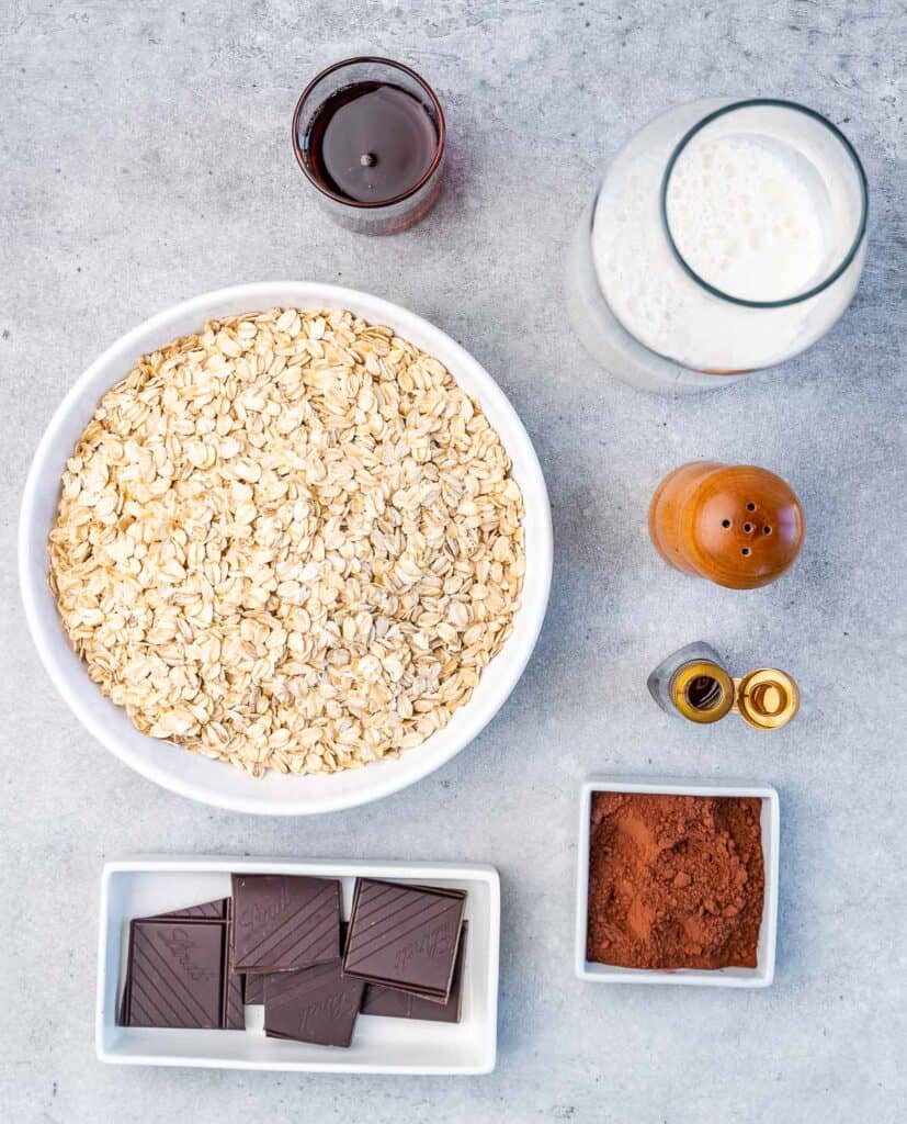 ingredients to make hot cocoa chocolate oatmeal breakfast bowl laid out