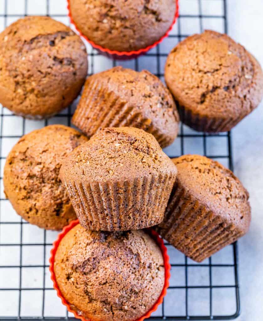 Cooled gingerbread muffins on a wire rack.