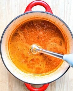 blending the soup to in the pot to get a creamy texture.