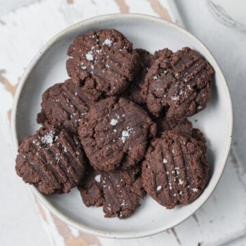 top view of chocolate cookies on a round white plate