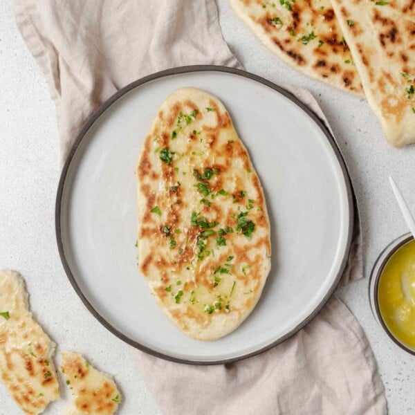 top view cooked naan bread on a round plate