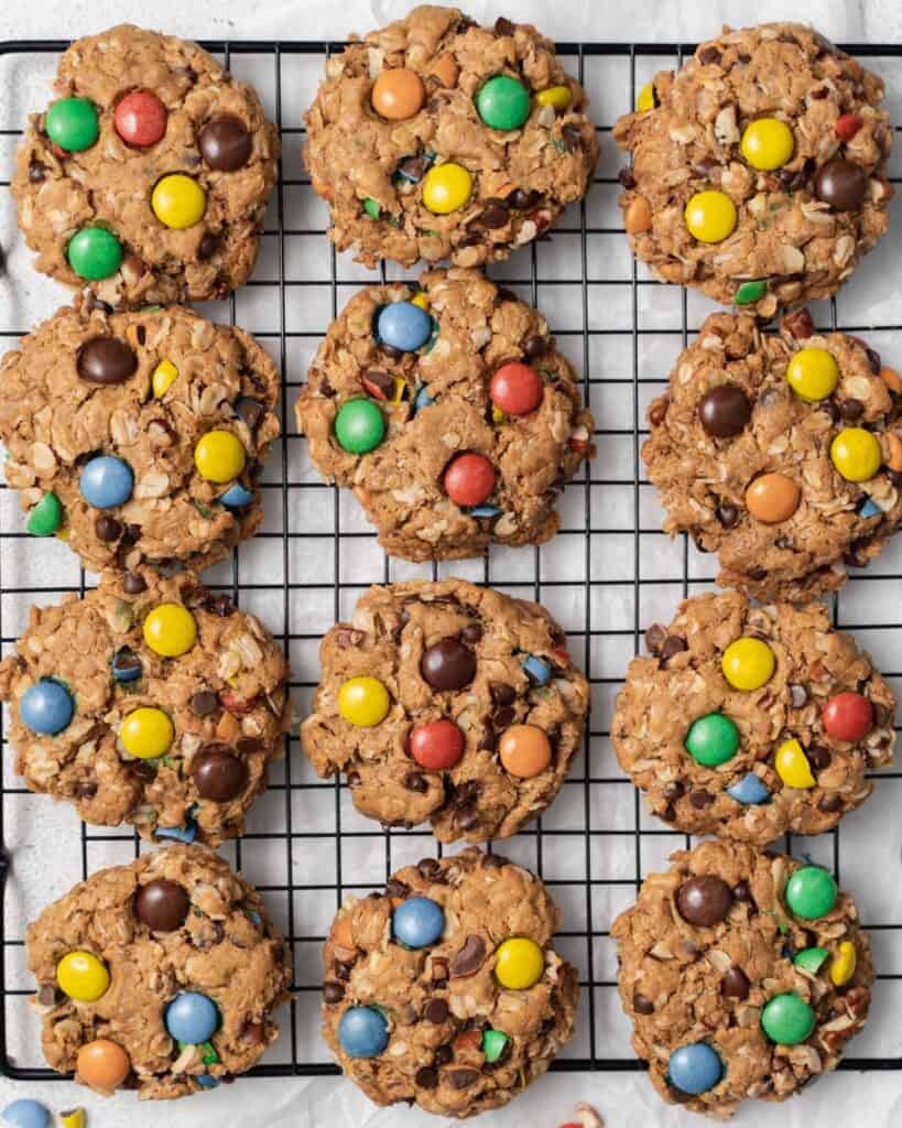 top view of baked m&m monster cookies on a wire rack