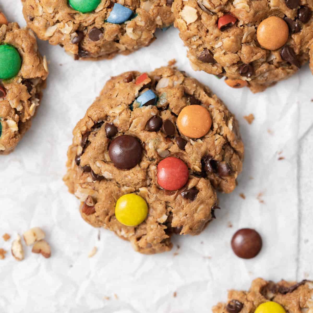 top view of a baked cookie topped with m&m on a parchment paper