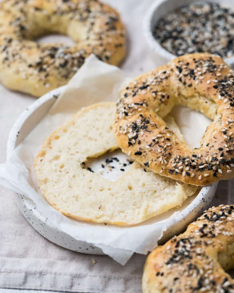 sliced baked bagels on a plate 