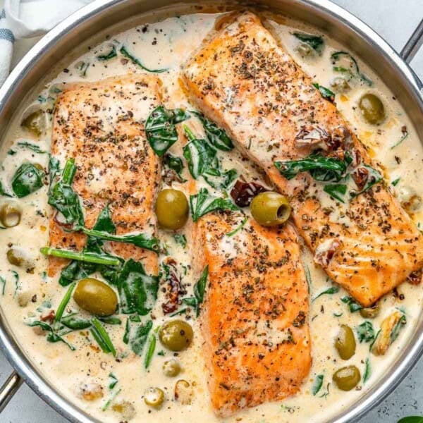 Salmon filets in a creamy coconut and spinach sauce.