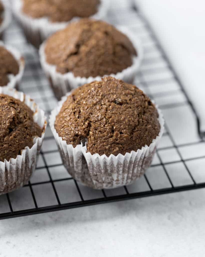 Healthy bran muffins on a wire cooling rack.