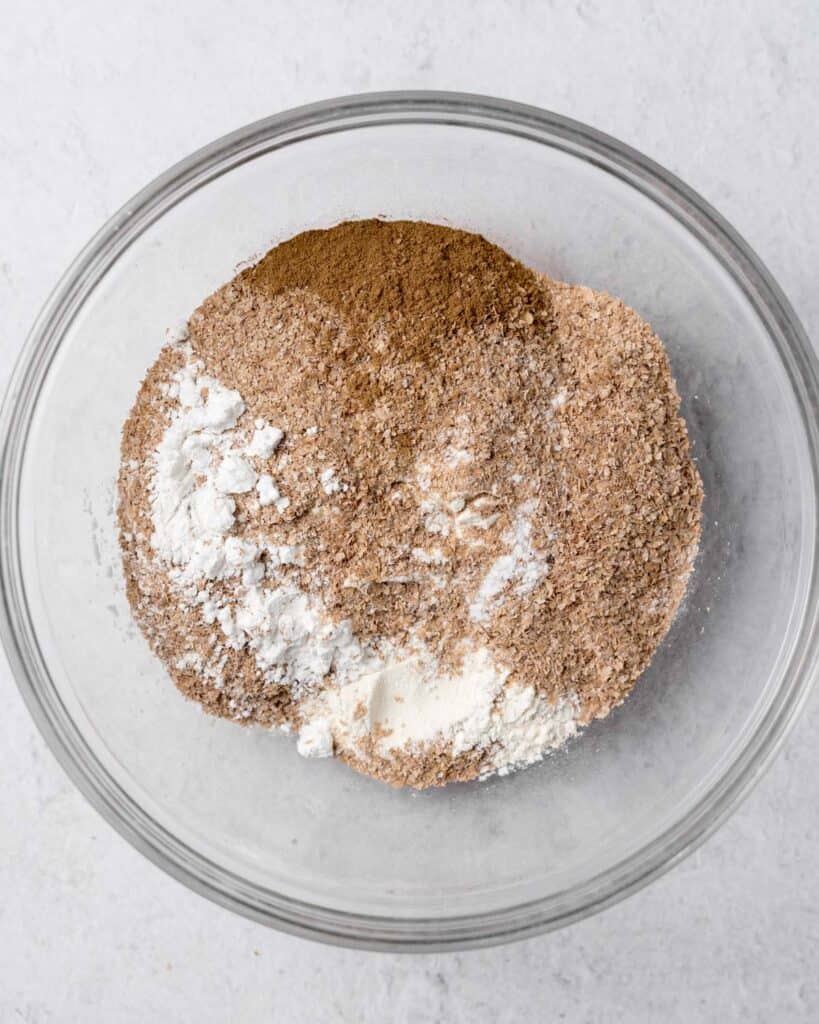 Flour, wheat bran, cinnamon, baking powder and baking soda in a large bowl.
