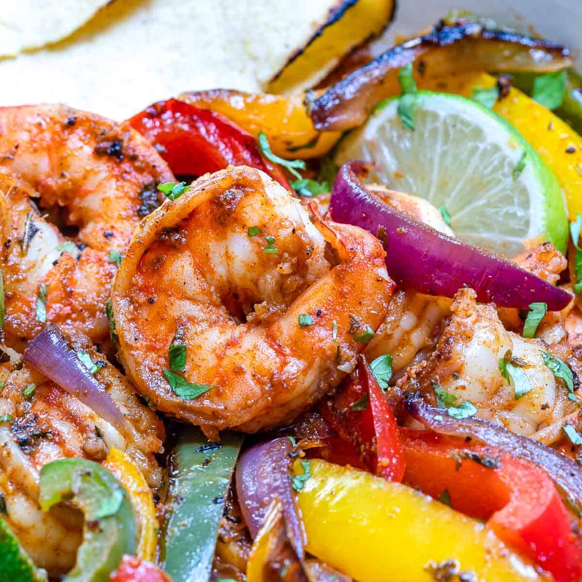cooked shrimp with fajita seasoning in a skillet.