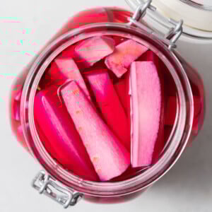 pickled pink turnips in a jar.