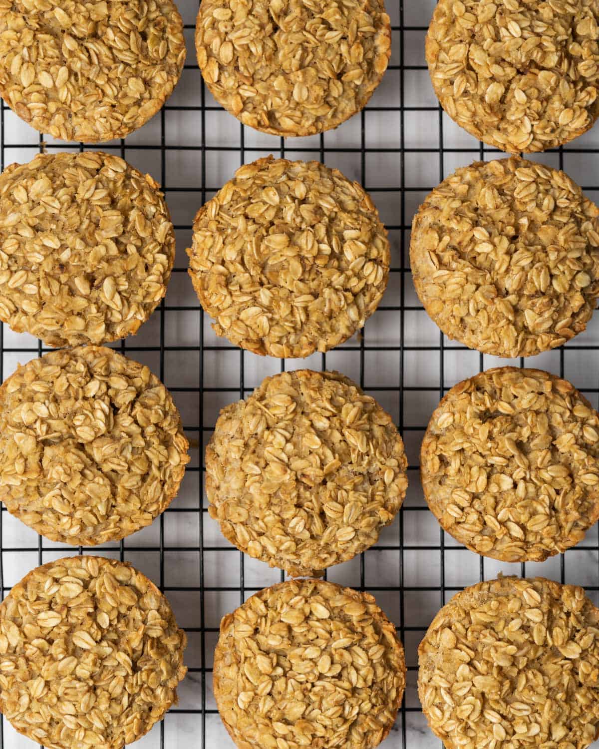 baked muffins added to a pan and allowing it to cool.