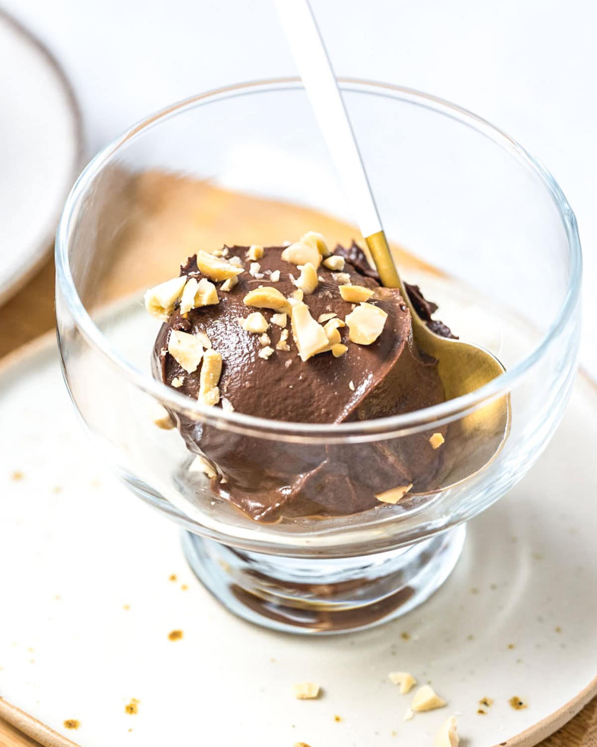 a small glass bowl with chocolate avocado ice cream.