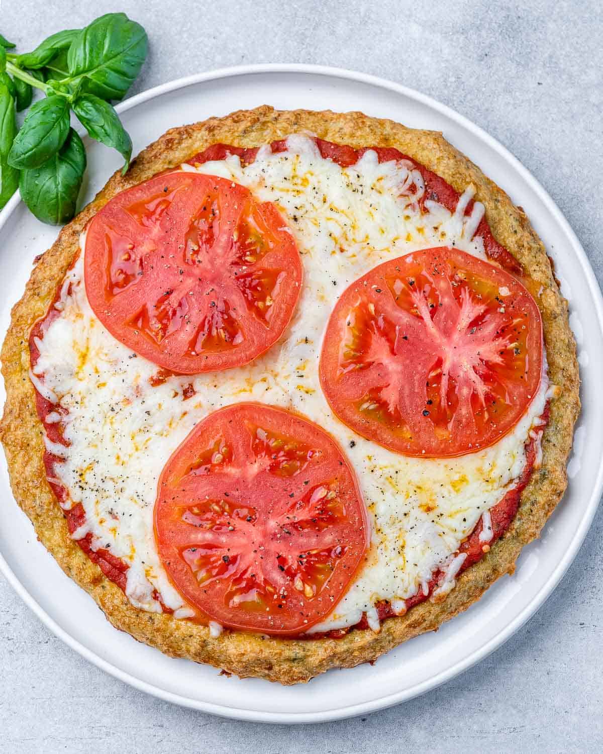 Pizza topped with cheese and tomatoes.