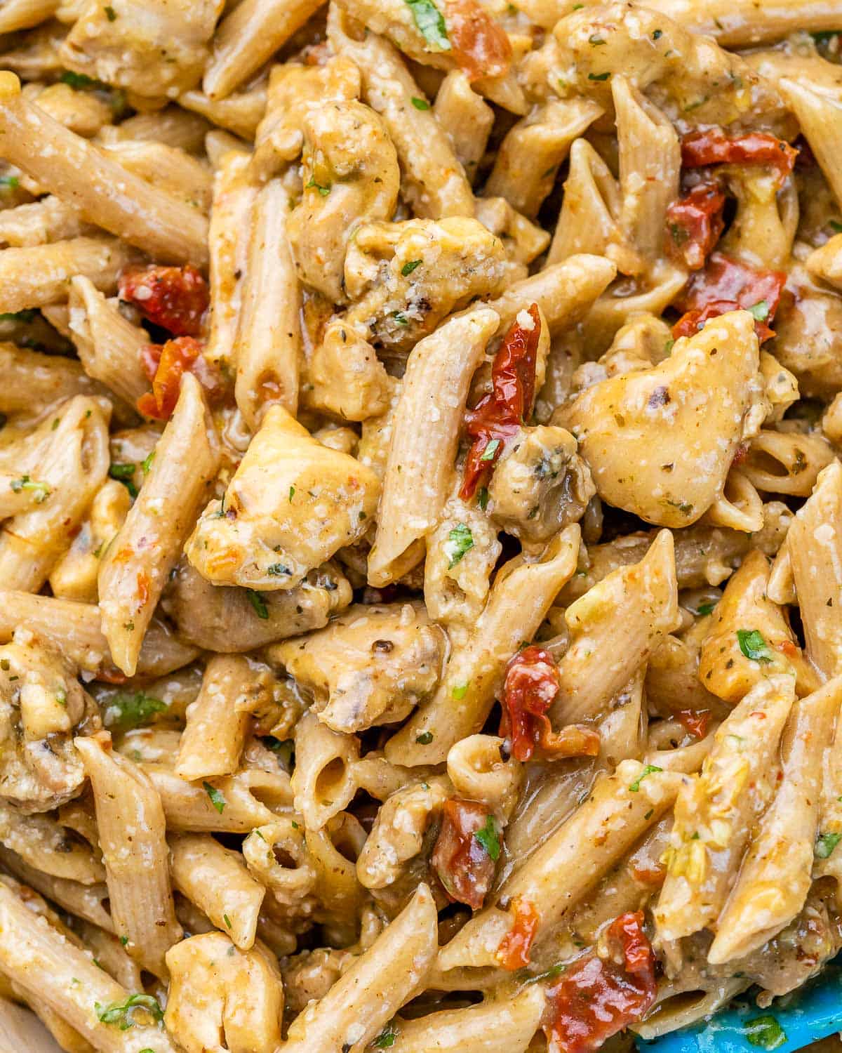 close up view of chicken penne pasta on a skillet