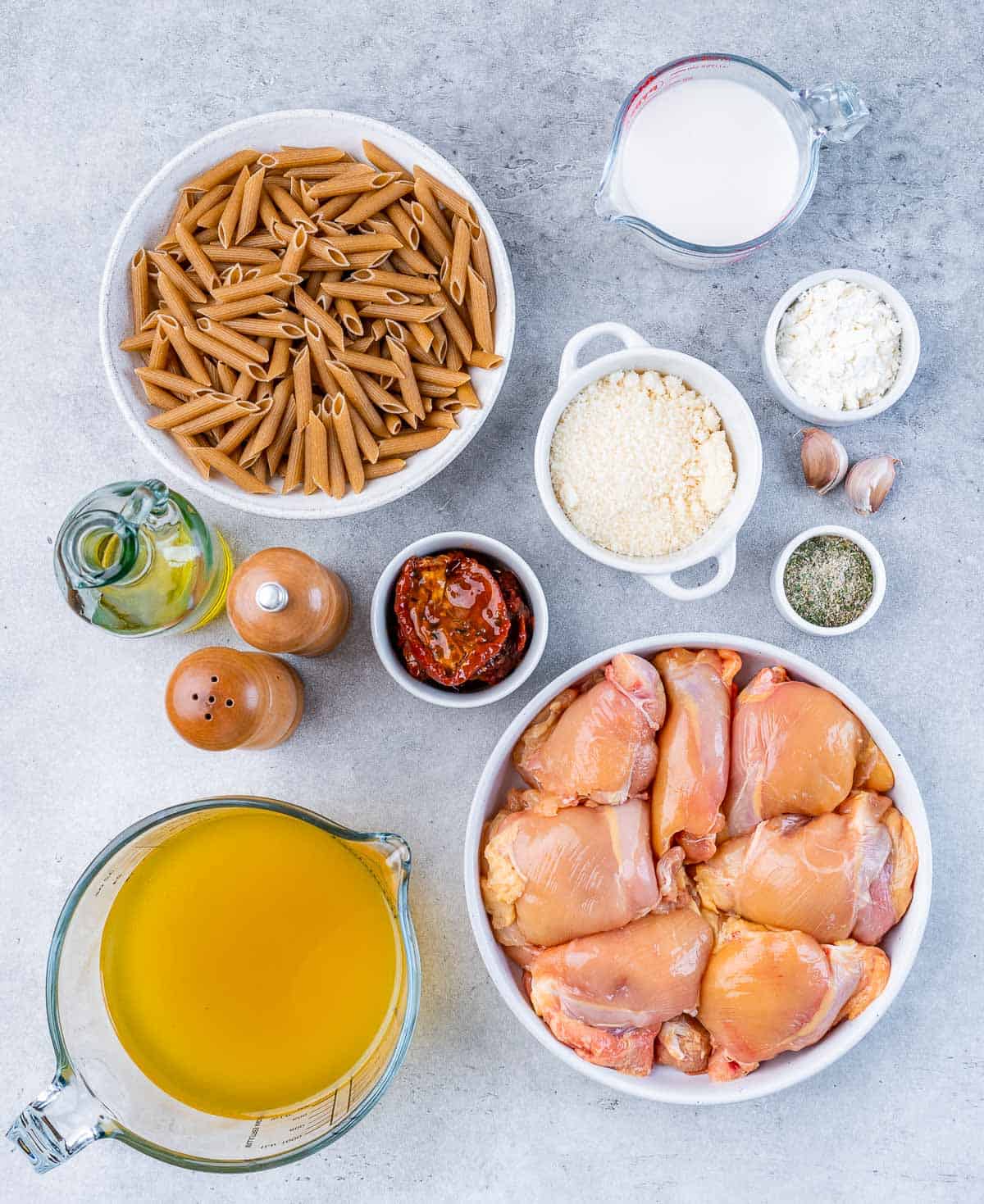 Ingredients to make marry me chicken pasta displayed