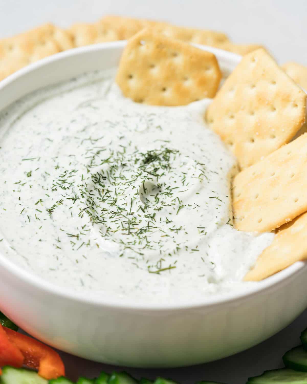 Cottage cheese dip with crackers dipped in it.