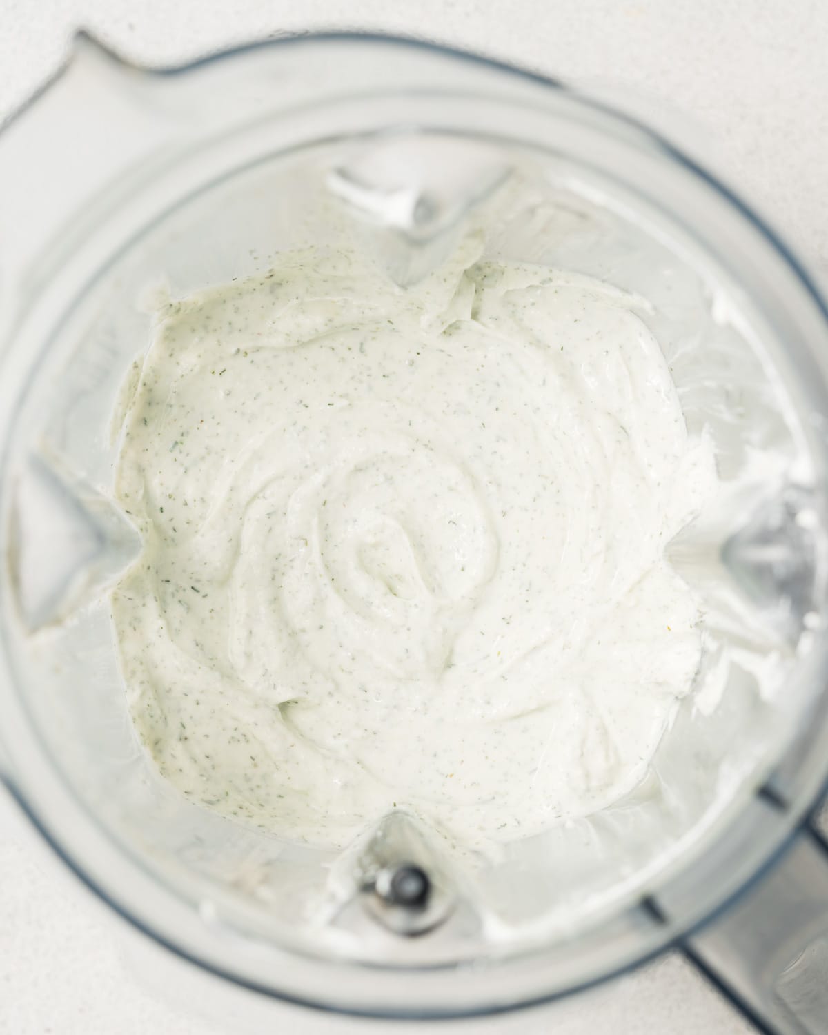 Blended cottage cheese with seasonings in a blender.