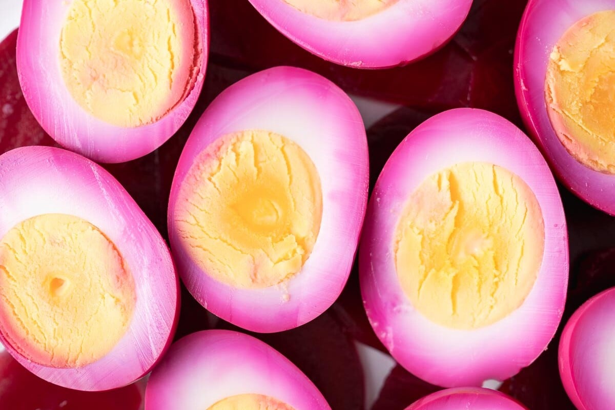 Close up of halved beet picked eggs.