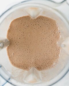 Blended coffee smoothie in a blender.