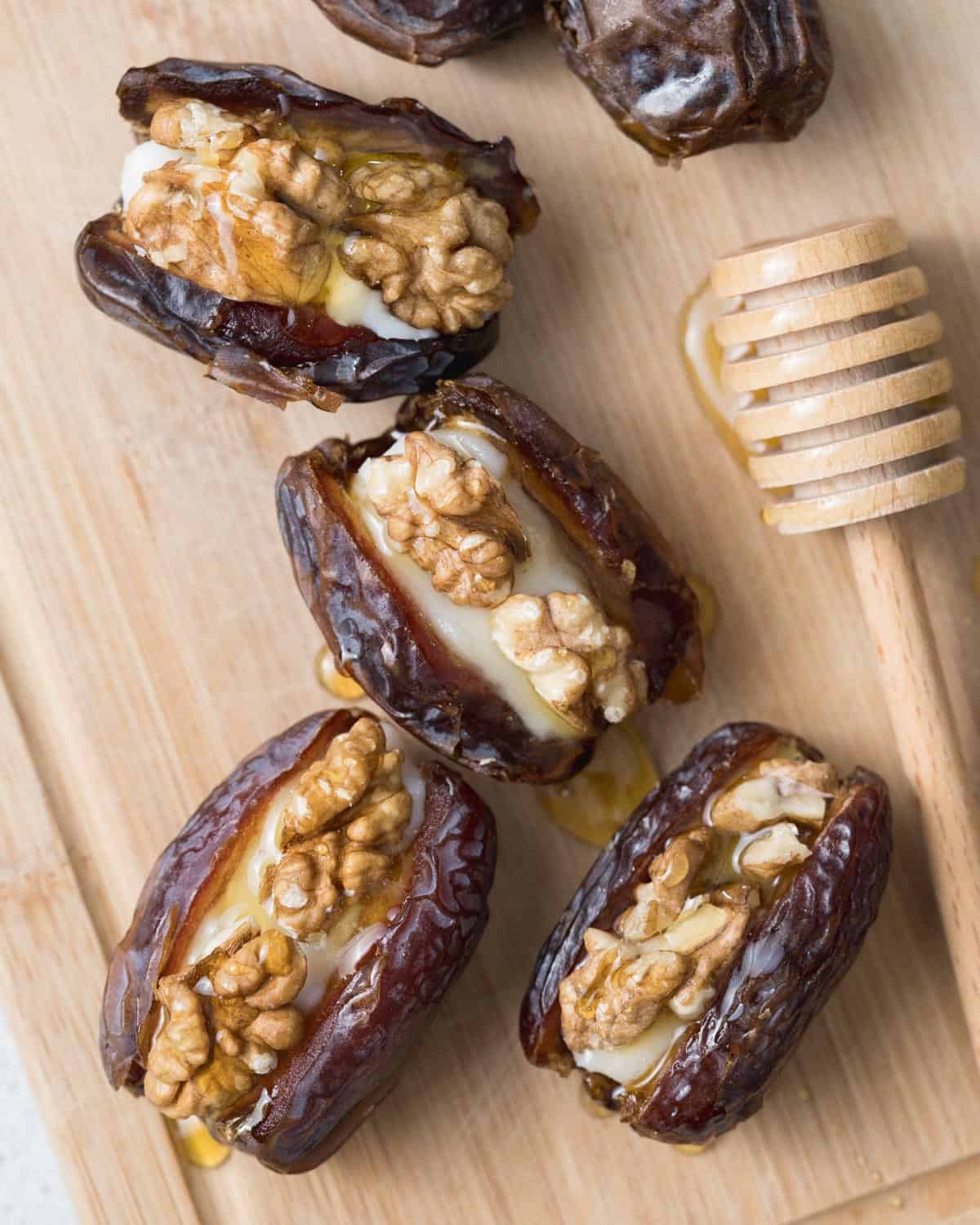 stuffed dates on a cutting board.