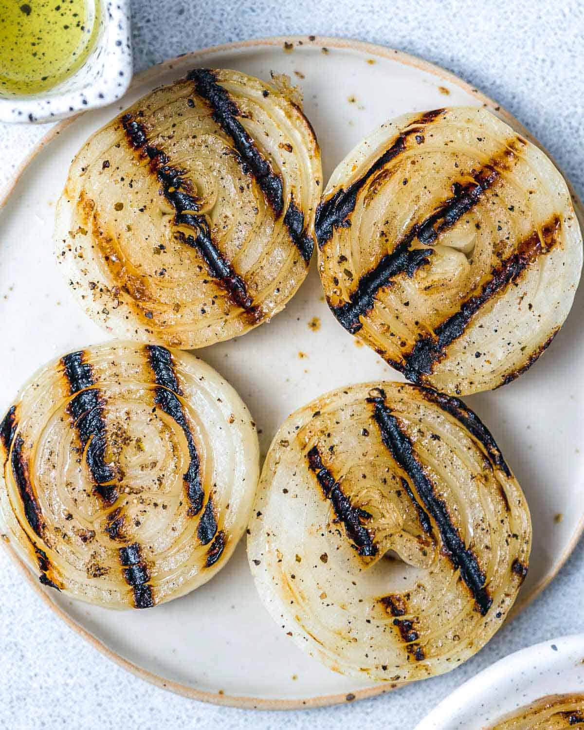 Grilled onion slices on a plate.